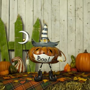 iron Halloween pumpkin figurine with face mask in witch hat holding staff