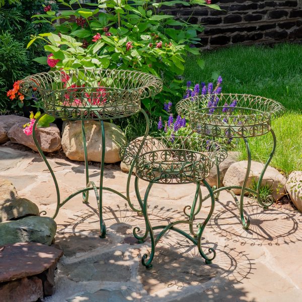 3 different sized plant stands in antique green with woven iron baskets