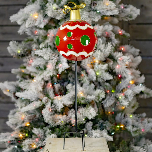 Metal Red Christmas ornament ball with green polka dots on tall black iron garden stake