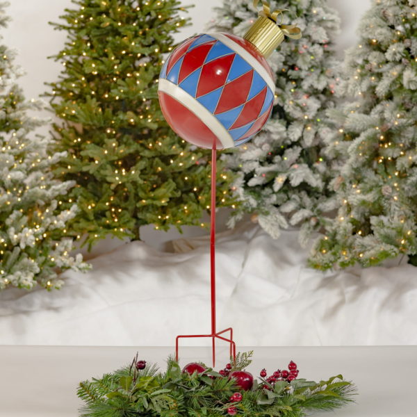 Full View of Large Iron Christmas Ball Sitting on a Stake