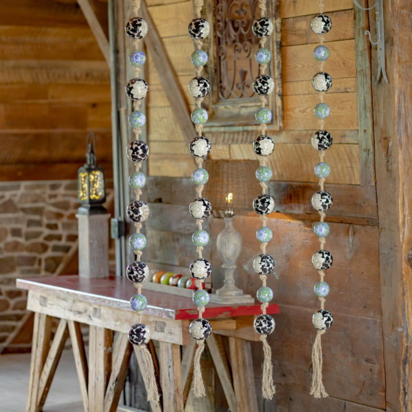 Twelve Ceramic Floral Decorations on Display in front of a Table