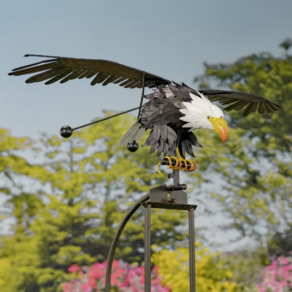 Eagle rocking stake with a sky background with wings open