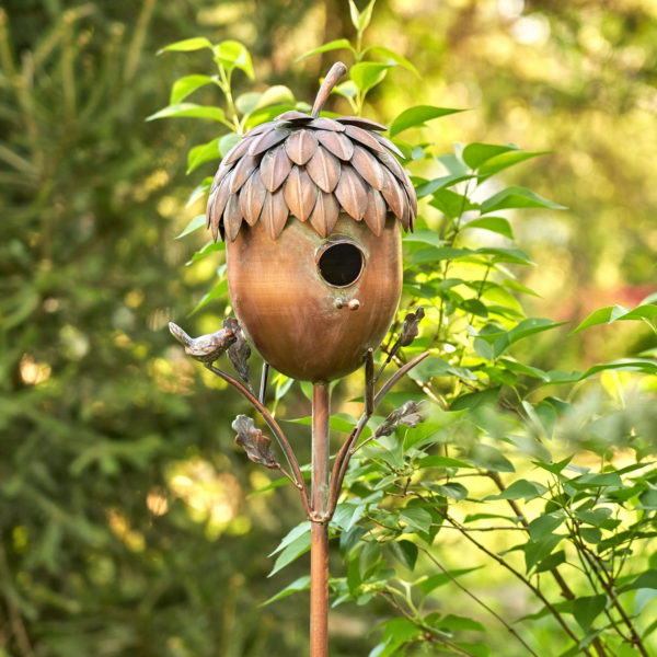 Turned Right Side View Iron Birdhouse sitting on a Stale with Bird and Leaf Details