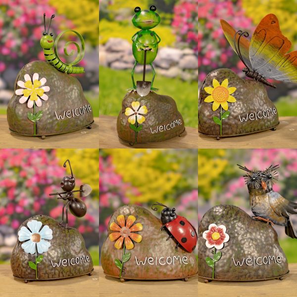 This image shows six garden decorations. Each one has a small animal or insect sitting on a rock with a flower and the word welcome on it. The animals include a caterpillar, frog, butterfly, ant, ladybug, and owl.