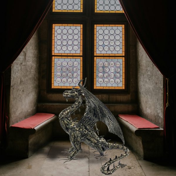 Photo of a metal dragon statue in a castle room showing detail and the glossy metallic color