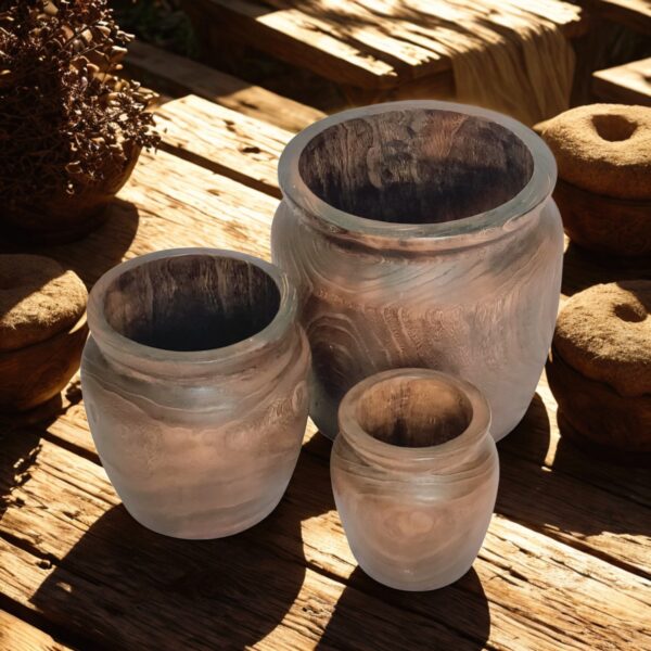 image of three wooden nesting planters with a rustic background