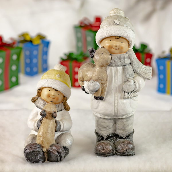 Boy and Girl Sitting and Standing- Holding and Petting Reindeer- Christmas Gifts in Background