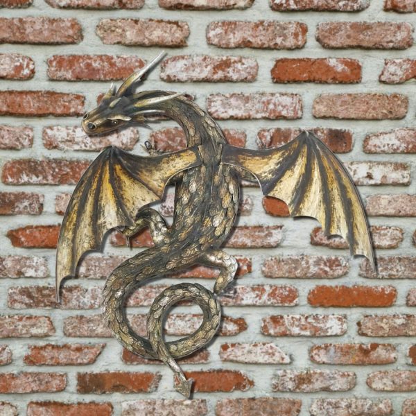 32.75' Tall metal dragon wall decor with gold and metallic color against a brick wall