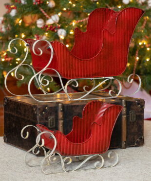 Set of 2 Victorian style red iron sleighs