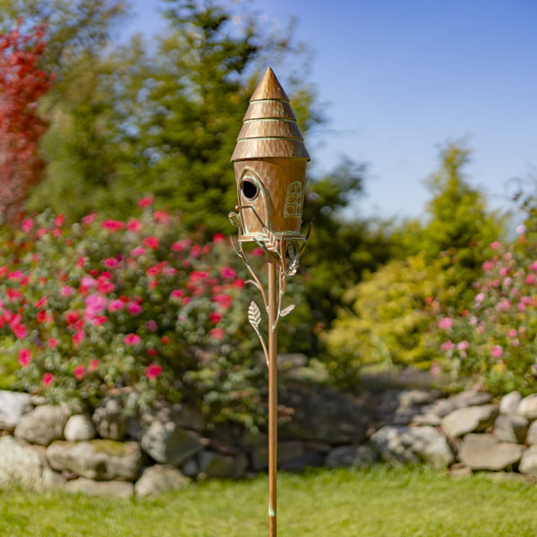 Iron birdhouse with cone roof in antique copper finish with patina details