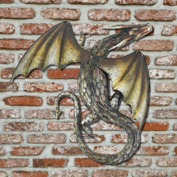 29.25 Tall metal dragon wall decor with gold and metallic color against a brick wall