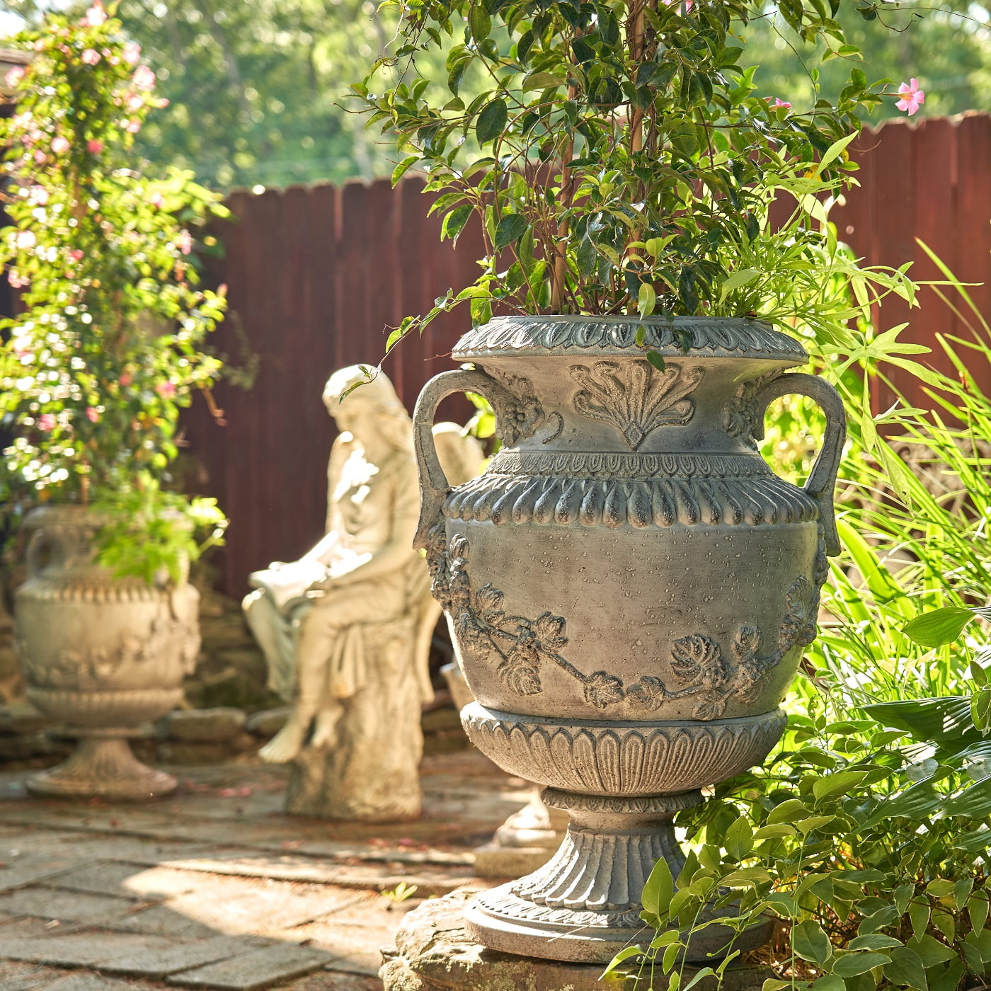 30.7 inch tall classic urn style flower planter with ornaments and 2 handles in antique white finish in garden