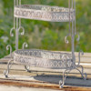Close up image of the bottom of the Antique Grey Plant Stand showing you the detailed design around ever tier