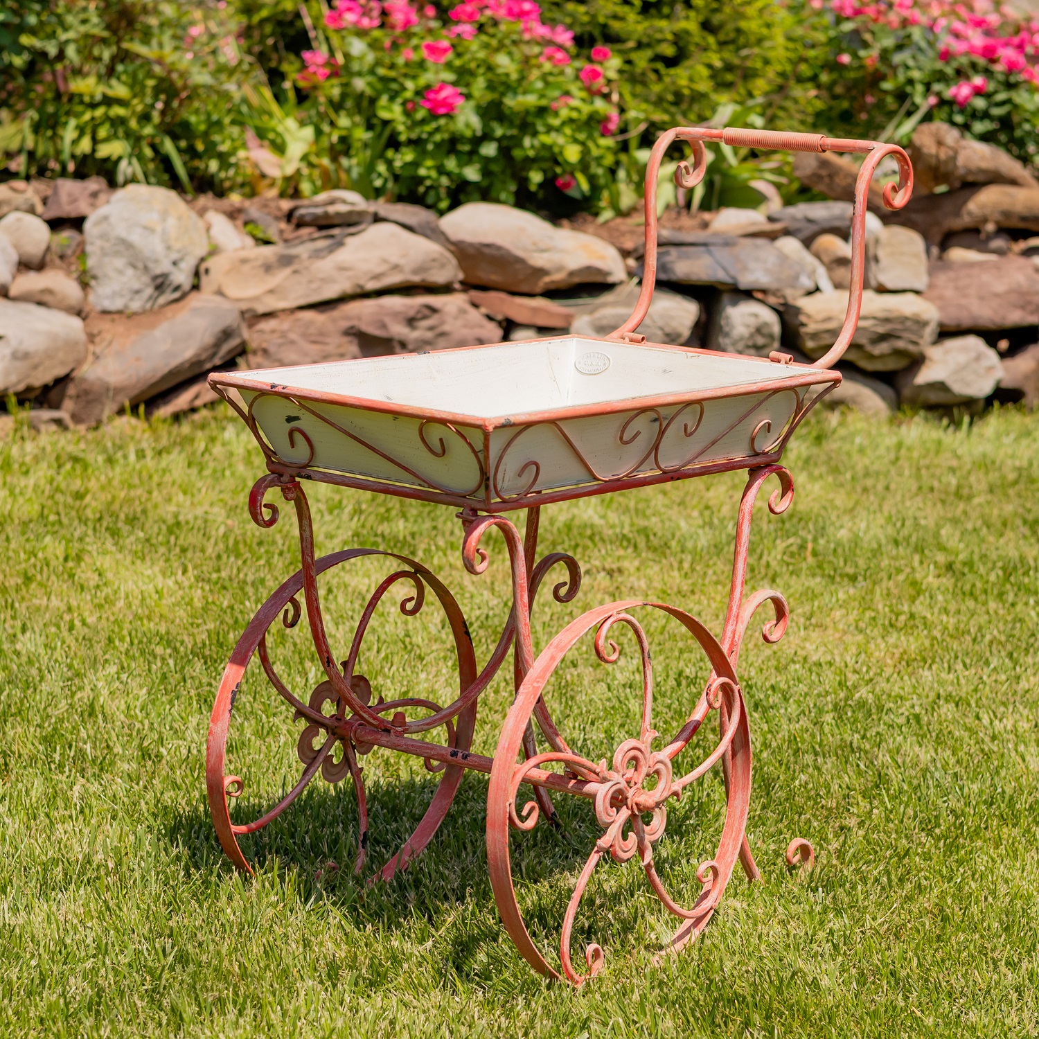 metal flower cart with white removable display bin and distressed hand painted pink iron frame with 2 wheels and handle