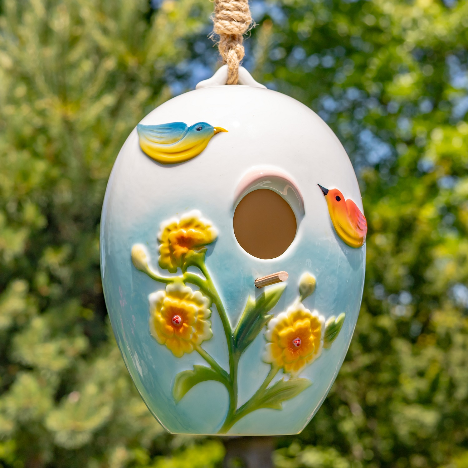 The Fauna style features a pastel blue ombré base with hand painted birds and daffodils.