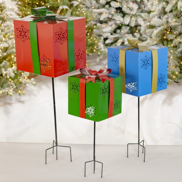 a Trio of Iron Handmade Giftbox Stakes with Bows and Snowflakes