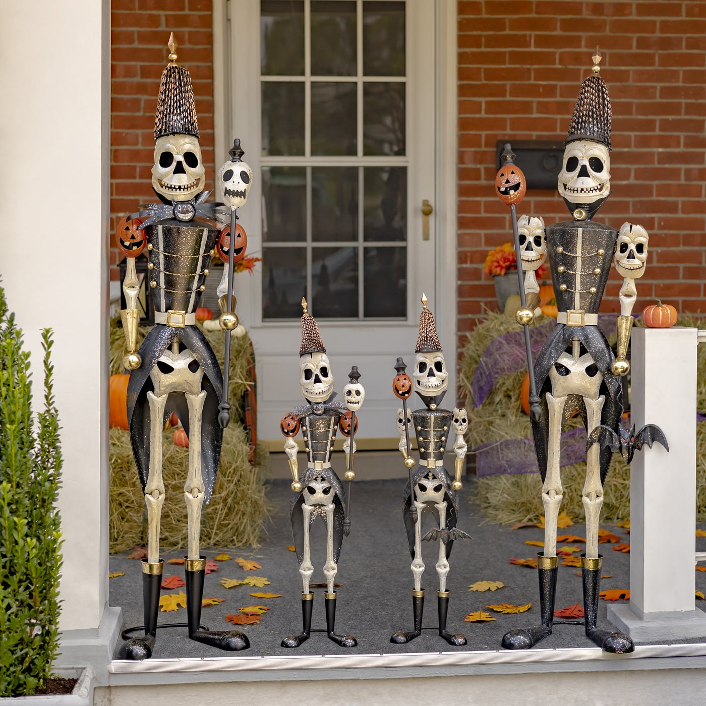 63.5 inch tall large set and 37 inch tall small set of skeleton soldiers holding staffs Halloween decorations