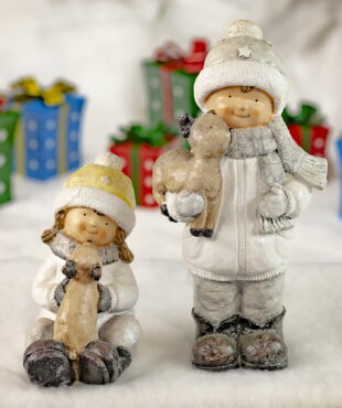 Boy and Girl Sitting and Standing- Holding and Petting Reindeer- Christmas Gifts in Background