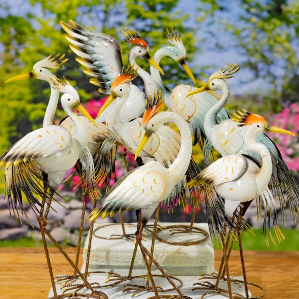 image of many colored heron garden figurines with an outdoor background