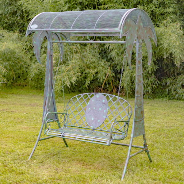 Full View of Hanging Metal Swing Bench with Palm Trees in a Verdi Green Finish