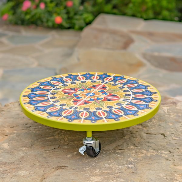 Flat round plant trolley with mosaic tiles on top in colors chartreuse, blue and red