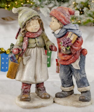 Little Boy and Girl Sharing Their First Kiss- Holding Gifts- Weaing Red and Green Hats, Scarves and Gloves