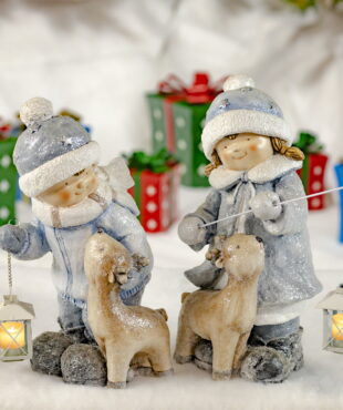 Children Holding Lighted Lanterns- Petting Reindeer