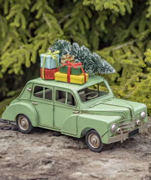 Antique Distressed Finish Car with with Christm as Tree and Gifts on the Rooftop