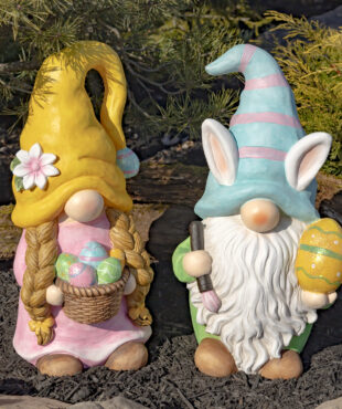 One set of Easter Gnomes in pastel colors with the male gnome holding a large yellow Easter egg and the female gnome holding a basket of colorful Easter eggs