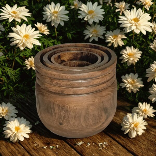 image of four round wooden planters with a rustic background