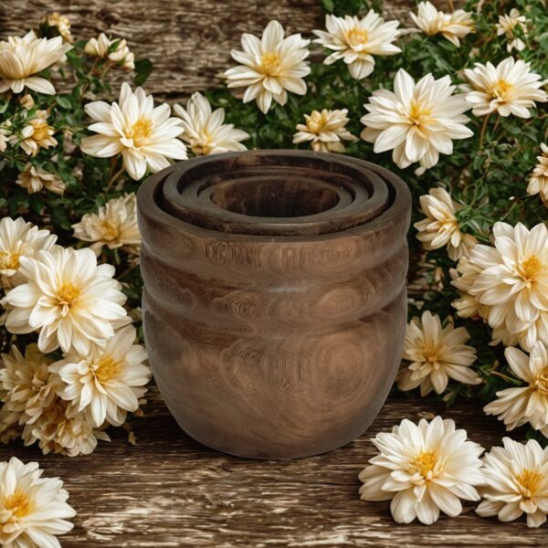 Image of four wooden nesting bowls with rustic background