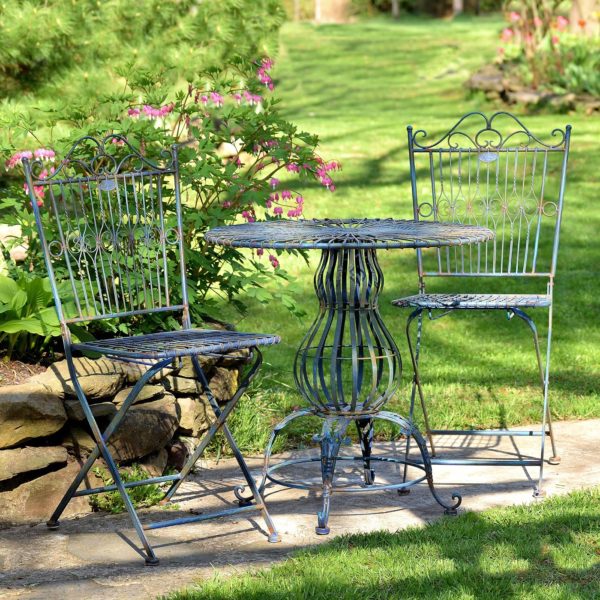 three piece iron bistro set with distressed antique blue finish includes two folding metal chairs and one round table with pretty decorative stand