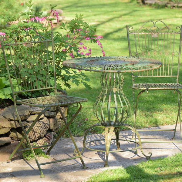 three piece iron bistro set with distressed antique green finish includes two folding metal chairs and one round table with pretty decorative stand