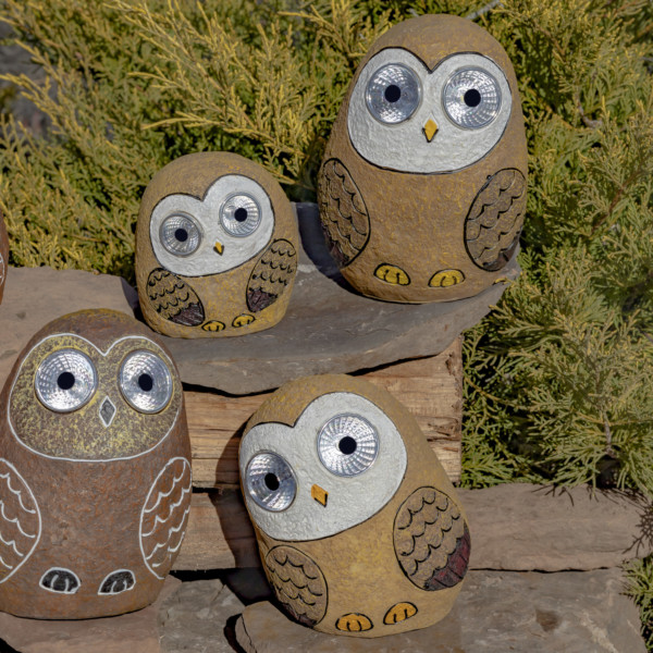 One set of 3 Solar Owls sitting on some rocks in Tan Brown looking at you with there round big eyes that lit up in the dark