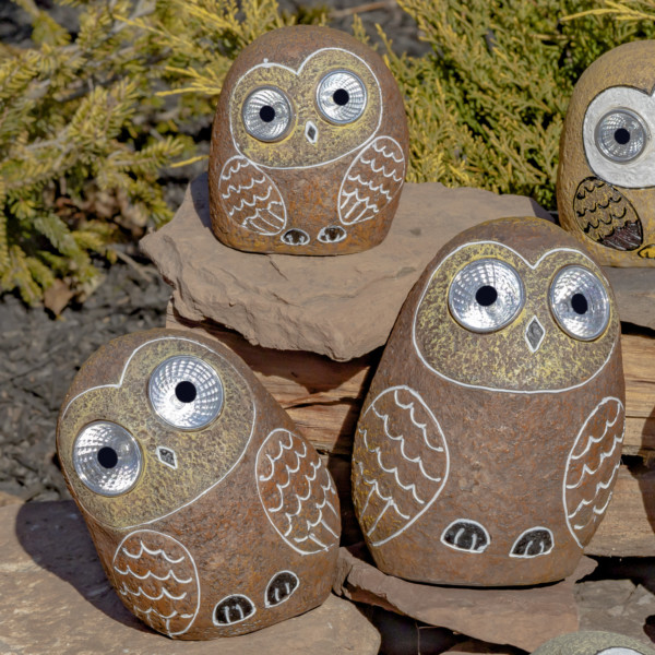 One set of 3 Solar Owls sitting on some rocks in natural Brown looking at you with there round big eyes that lit up in the dark
