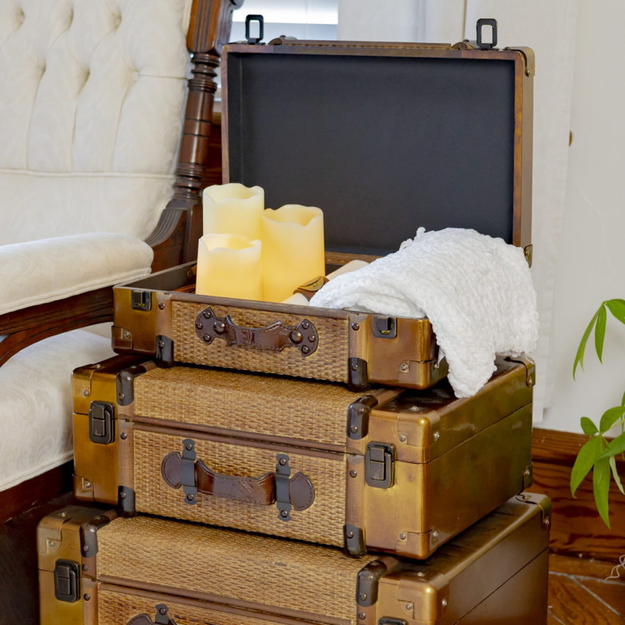 Stacked Suitcases from small to Largest with Decorative Accents inside