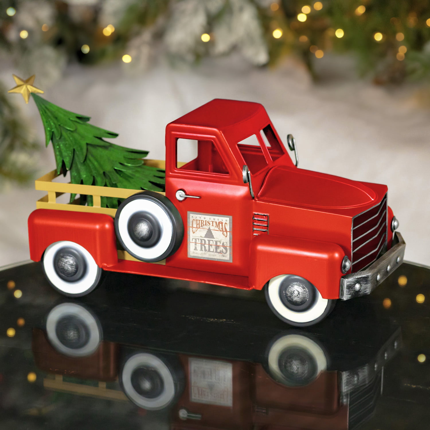 Red metal truck deals with christmas tree