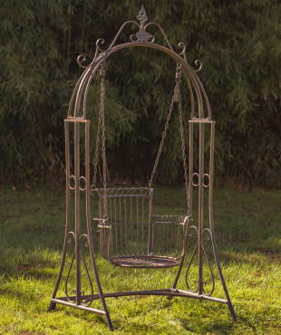 Large bronze iron swing chair with curlicue designs to the top of the swing and a neatly deigned chair with four iron chains holding it up