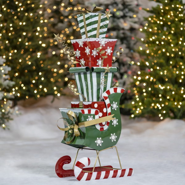 4 ft. tall iron Christmas sleigh with candy cane runners full of large stack of metal gift boxes decorative Christmas display