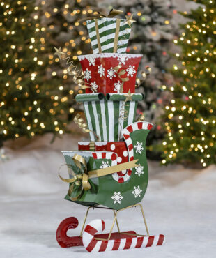 4 ft. tall iron Christmas sleigh with candy cane runners full of large stack of metal gift boxes decorative Christmas display