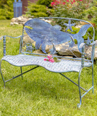 Blue coastal curvy bench with whale design on the backrest with other little seacreatures