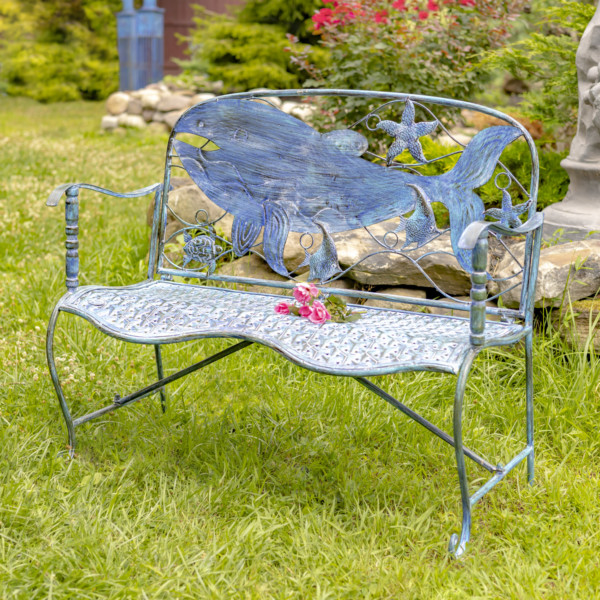 Blue coastal curvy bench with whale design on the backrest with other little seacreatures