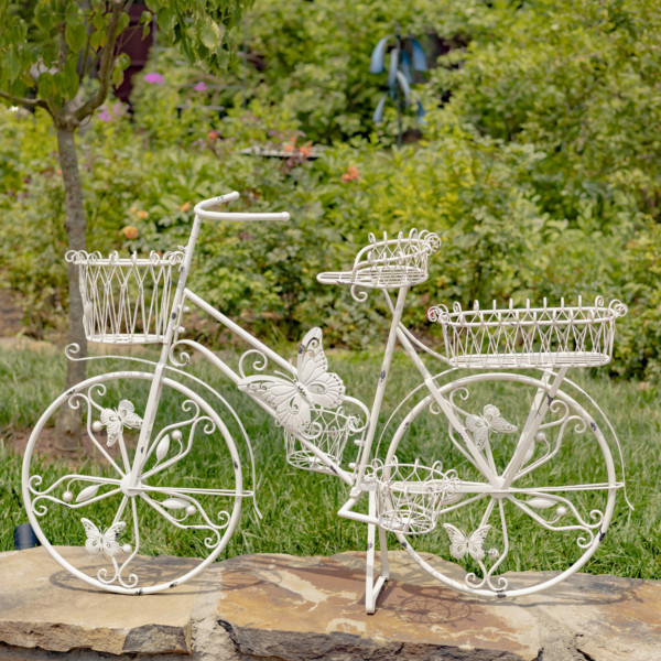 Large white bicycle butterfly plant stand with four baskets attached to the bike that can hold plants and flowers