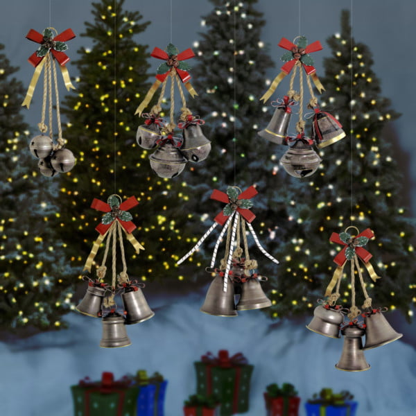 Set of Six Hanging Bells with Bows in a Galvanized Finish in front of lighted up Christmas trees and gift boxes