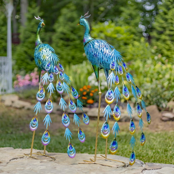 pair of 34 inch tall metallic peacock outdoor figurines in garden