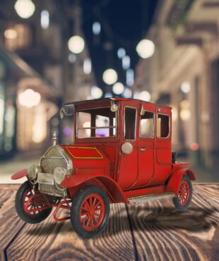 Antique Red Automobile - wth mirrors and head lights and black wheels