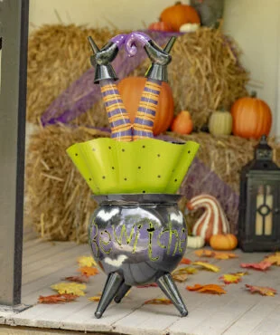 Metal Halloween decoration with Witch up sided down in Cauldron