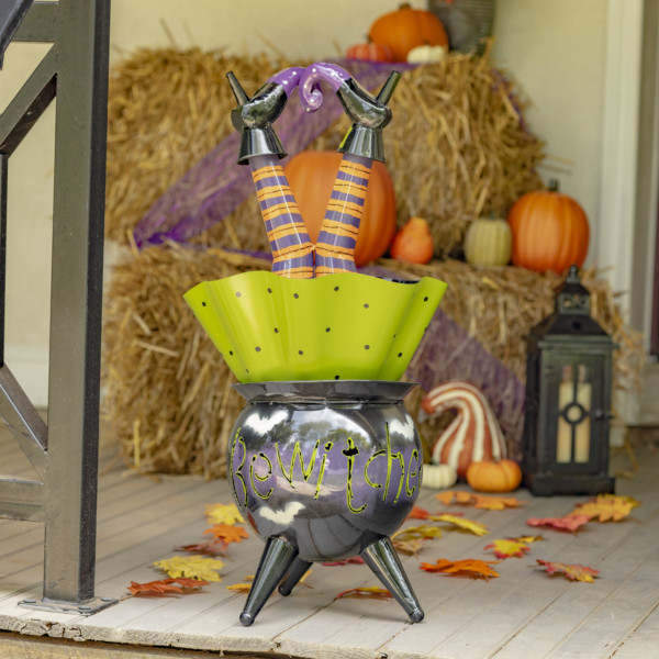 Metal Halloween decoration with Witch up sided down in Cauldron