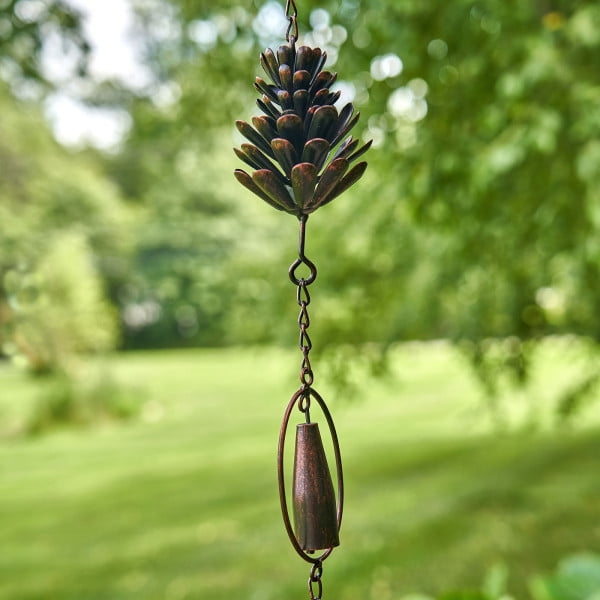 close up 2 sections of antique bronze hanging pinecone and bell rain chain