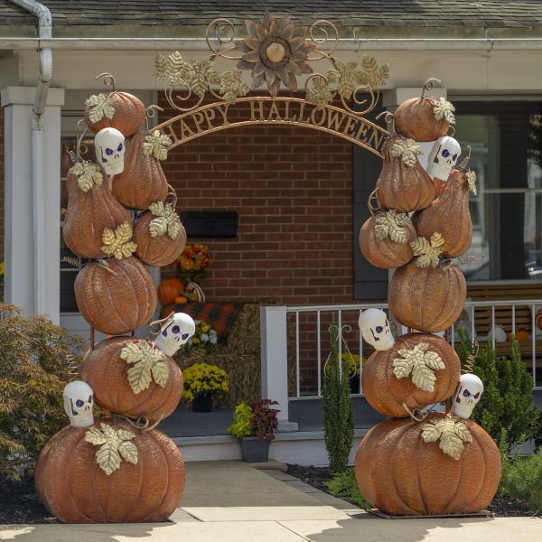 9.6 feet tall large iron Halloween arch with orange pumpkins, white skulls with purple LED lights, golden leaves and Happy Halloween sign in front of house entrance